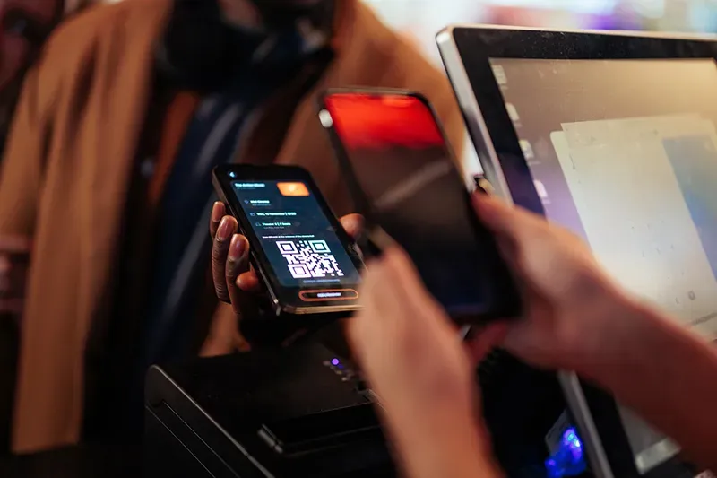Person scanning a mobile ticket